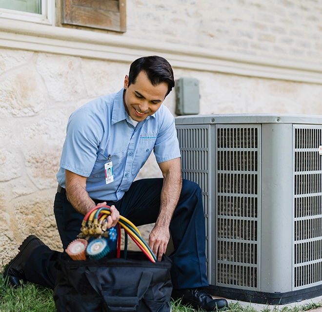An asv technician installing heat pump.