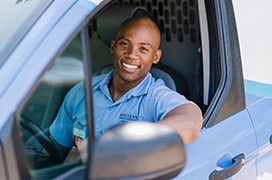 Technician driving a van.