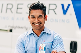 Technician standing near a van.