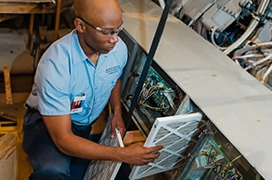 Aire Serv technician updating air filters.
