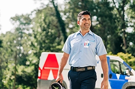 Technician walking in garden.