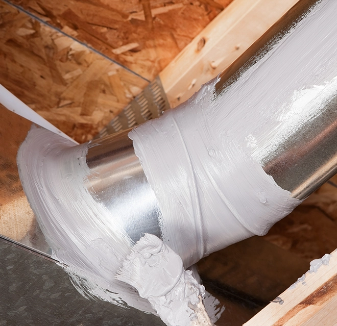 Aire Serv service professional inspecting commercial HVAC system.