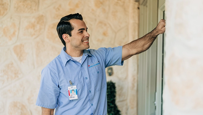 Aire Serv professional knocking on the door of an Aire Serv customers home.